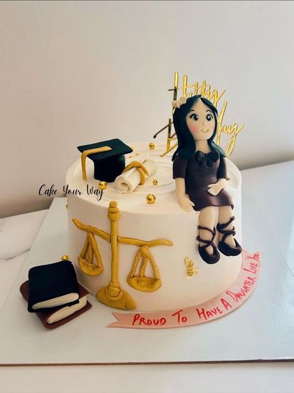 A proud moment for a daughter's graduation, celebrated with a custom law-themed cake.
