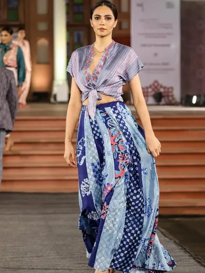 Our textiles come alive on the runway. This ensemble, created in collaboration with Studio Swiatlo, features a blend of pattern dyeing and discharge printing on handloom fabric, showcasing the versatility of our craft for contemporary fashion.