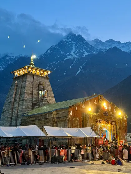 The divine glow of the Kedarnath temple at night, set against the majestic, snow-covered Himalayas. This is the moment of peace and awe that every pilgrim dreams of, a sight that makes the entire journey worthwhile.