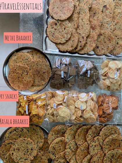 My travel essentials! This spread includes dry snacks like Methi Bhaakri and Masala Bhaakri, perfect for carrying on trips.