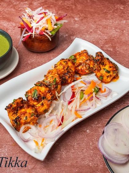 Our Achari Tikka offers a tangy and pickled flavour. The chicken is marinated in a blend of pickling spices, giving it a unique and zesty taste that stands out.