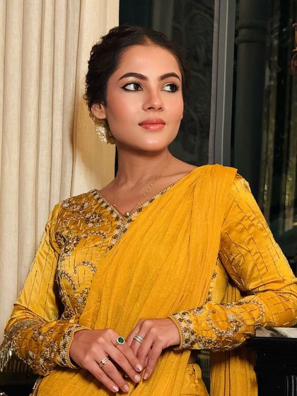 A beautiful look for a wedding or party, featuring soft, warm tones on the eyes and a natural braided hairstyle.