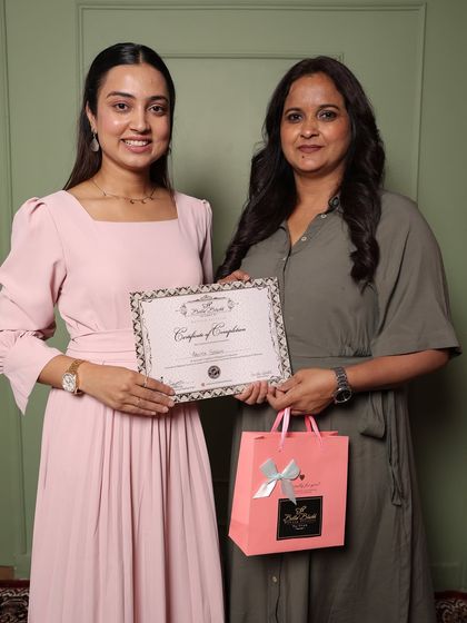 Another happy graduate, Anita, receiving her certificate. She was a dedicated student and I'm excited to see her career grow.