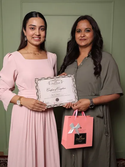Another happy graduate, Anita, receiving her certificate. She was a dedicated student and I'm excited to see her career grow.