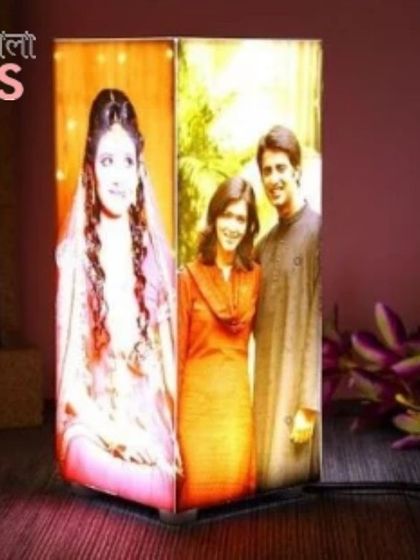 This is a product shot of the personalized corner table lamp, showing how your wedding and couple photos can be displayed with a warm, inviting glow.