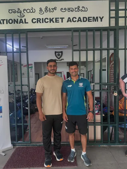 With a senior coach at the National Cricket Academy. Learning from the best is a privilege.