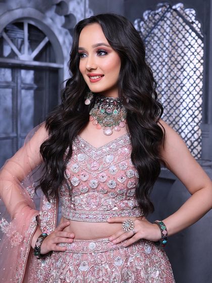 This shot showcases the beautiful details of the jewellery and the outfit, with makeup that enhances the overall look without competing with it.