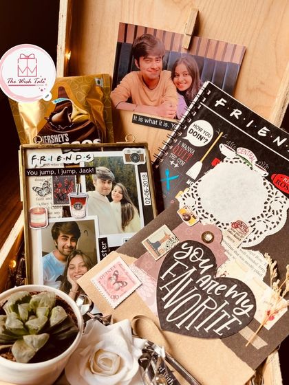 A F.R.I.E.N.D.S themed hamper for the ultimate fan. This box includes a vintage-style frame, a themed diary, a mini plant, and a handmade card, making it the perfect gift for your lobster.
