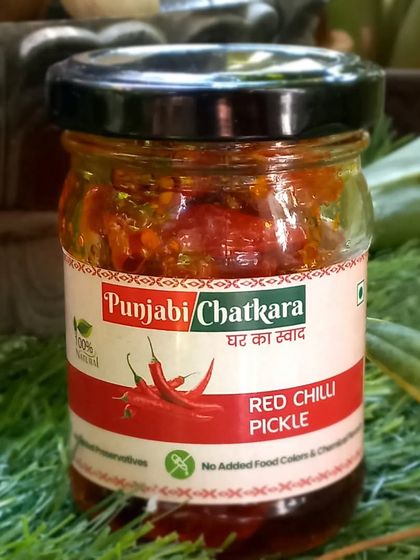 A close-up of the Red Chilli Pickle jar. You can see the rich colour that comes from natural chillies and spices, with absolutely no food colours used.