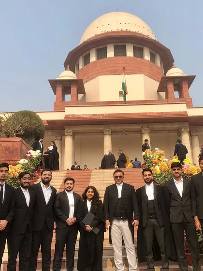 Our entire team, including interns and associates, with a senior advocate. This image captures the essence of my mentorship philosophy: a hierarchy of respect and learning where everyone grows together.