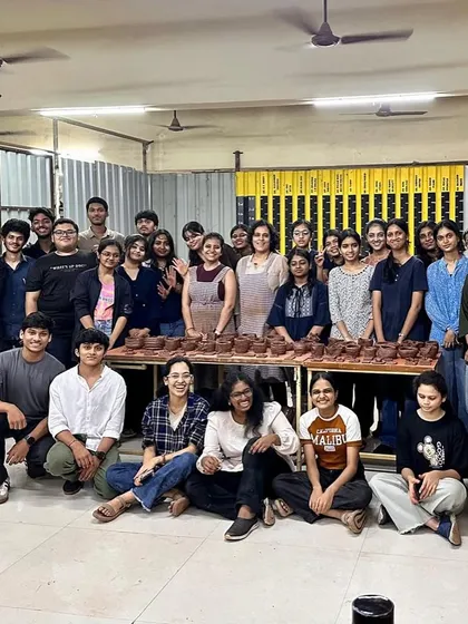 What a wonderful outcome. This is a group of architecture students I taught, proudly gathered around a table filled with the pieces they created during our foundation in clay workshop.