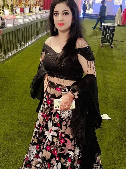 Another client looking fabulous in the black floral lehenga. The off-shoulder blouse and flowy skirt make it a flattering choice for all body types.