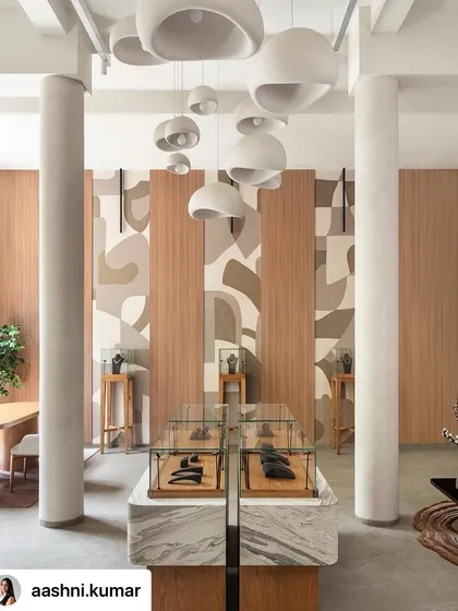 Inspired by the facets of a diamond, this abstract mural was created for a jewelry boutique. The design uses layered, earthy tones and clean forms to create a sense of rhythm and elegance, complementing the store's sophisticated interior.