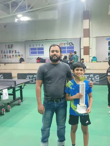 Coach celebrating with Arunim Aggarwal after he won Gold in the U-11 boys category at the 4th Delhi State Ranking Tournament.