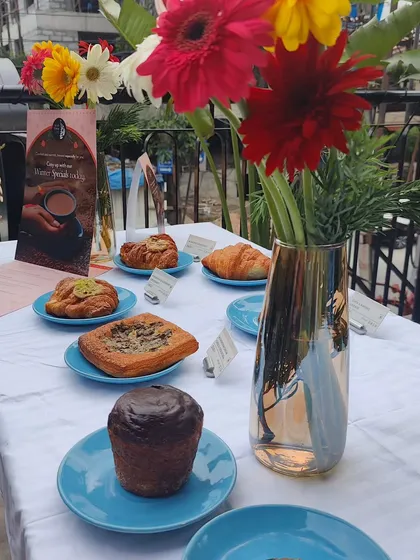 A spread of pastries from Suchali's Artisan Bakehouse at the Blue Tokai event. This image is perfect for promoting collaborations between brands.