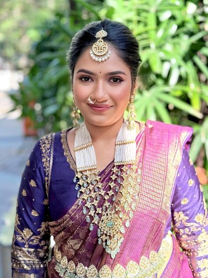 A close-up portrait taken outdoors, showing how the makeup looks in natural daylight.
