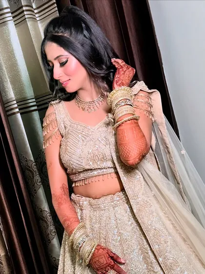 Elegance in every pose. The soft curls and glowing makeup create a timeless and romantic engagement look.