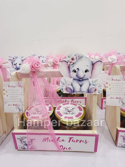 So sweet! This adorable baby elephant theme was designed for Midha's first birthday, presented in a pinewood crate.
