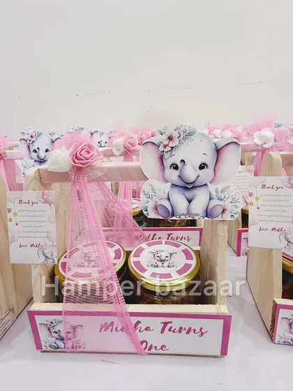 So sweet! This adorable baby elephant theme was designed for Midha's first birthday, presented in a pinewood crate.