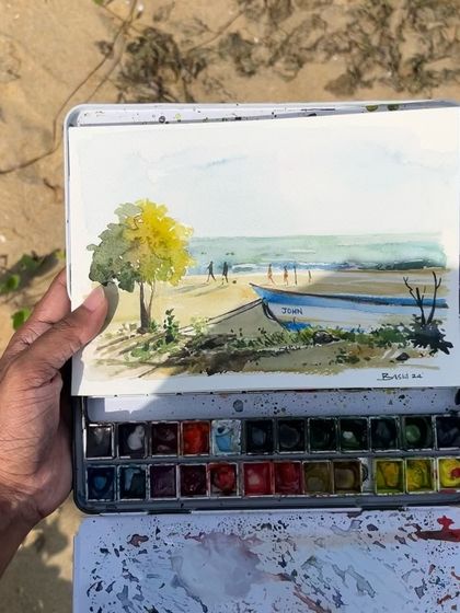 A close-up of my watercolor sketch of the beach. You can see the quick, loose brushstrokes I use to capture the scene's essence.
