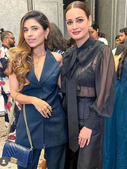 Here I am with a client at the Elle India lifestyle awards. For her, I created a simple yet elegant look with soft waves and a side part to complement her chic navy blue outfit.