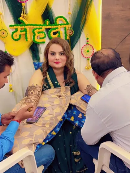Another angle of my team working on a bride, showing our coordinated effort and professionalism.