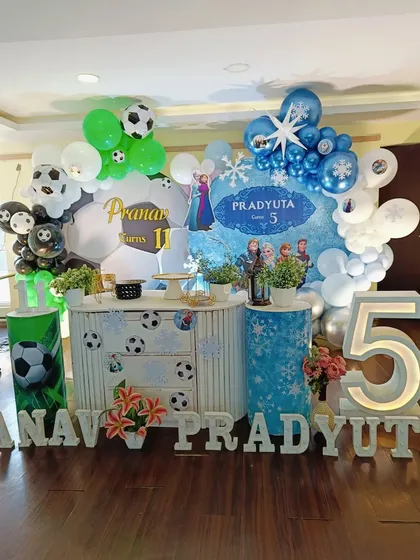 Another angle of the combined theme party, showing the custom-decorated table and props.