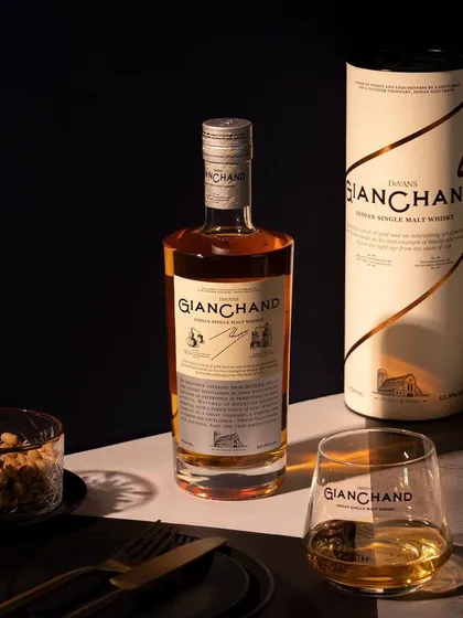 This moody shot for Gianchand whiskey uses strong contrast between light and shadow. The styling with the outer packaging and a glass of whiskey creates a complete, premium product story.