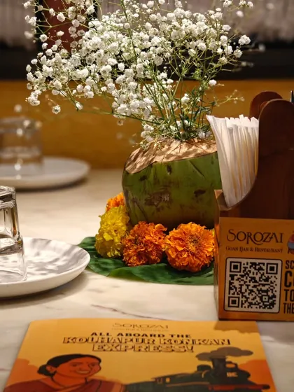 The table setting at the Sorozaï pop-up, complete with a QR code menu and fresh flowers. We received the best compliment that it felt like "Ghar Ka Khana" (home-cooked food) in a restaurant.