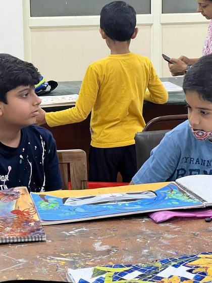 A candid shot from our in-person classes, where students share their work and get inspired by each other's progress.