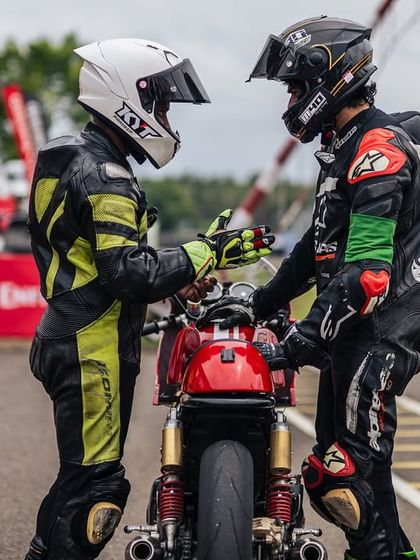 A moment of mentorship between two riders on the track. Our programs foster a supportive community where riders can learn from coaches and each other, sharing tips and encouragement.