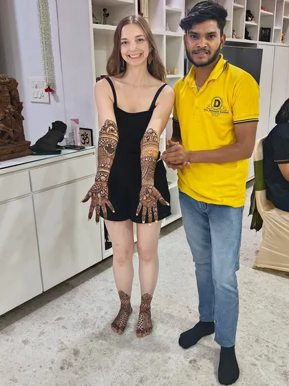 Another photo with our happy client, showcasing her full bridal mehndi.