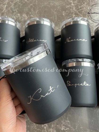 Sip, sip, hooray! These insulated black tumblers with lids are perfect for keeping your drinks at the right temperature on the go. Each one is personalized with a name in a flowing script.