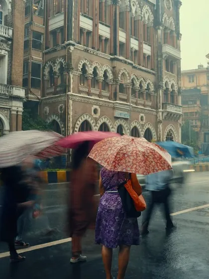 Mumbai's monsoon has a cinematic mood that I love. This shot uses a slow shutter speed to capture the movement of the crowd against the city's architecture, turning a typical rainy day into a piece of visual poetry. I am comfortable shooting in any weather to get the perfect shot.