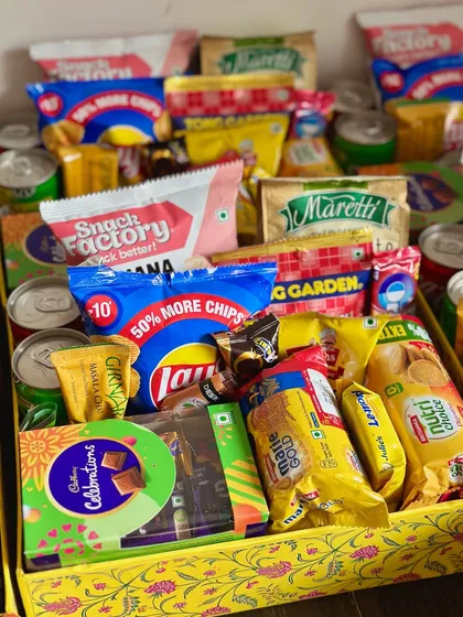 I love creating these super fun welcome baskets for out-of-town wedding guests! They are packed with a mix of sweet and savory snacks and drinks to make your guests feel right at home and ready for the celebrations.