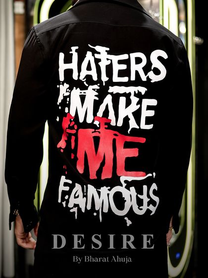 A close-up of the back of the 'Haters' eyes shirt, with its bold, graffiti-style text.