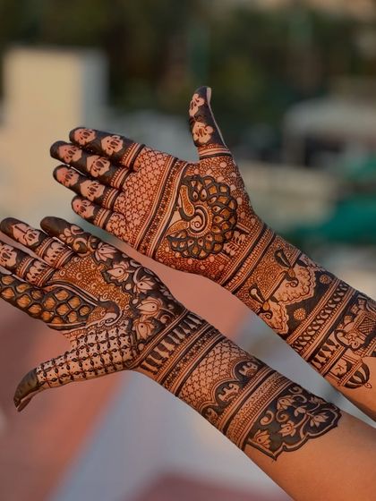 A dynamic pose showing the front and back of the hands, highlighting the different but complementary patterns.