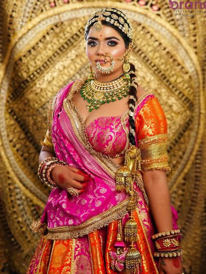 This portrait captures the bride's confident and regal presence, a result of professional makeup and styling that enhances natural beauty.