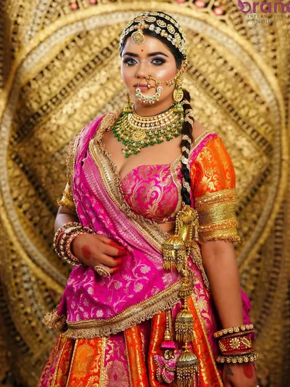 This portrait captures the bride's confident and regal presence, a result of professional makeup and styling that enhances natural beauty.