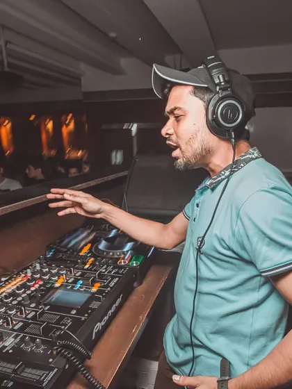 Getting hands-on with the Pioneer mixer to shape the sound and let the bass kick in at the right moment.