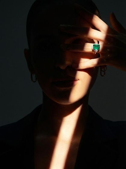 I love gemstone engagement rings for a pop of color. This exquisite natural green emerald ring is a stunning choice for the unconventional bride.