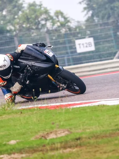Another angle of a rider pushing the limits, getting right to the edge of the track. Every inch counts when you're chasing lap times.