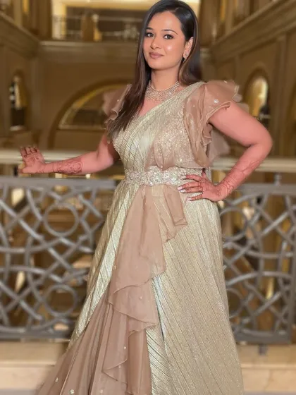 The full look, showcasing the beautiful saree gown and the elegant makeup. This is perfect for a reception or cocktail soirée.