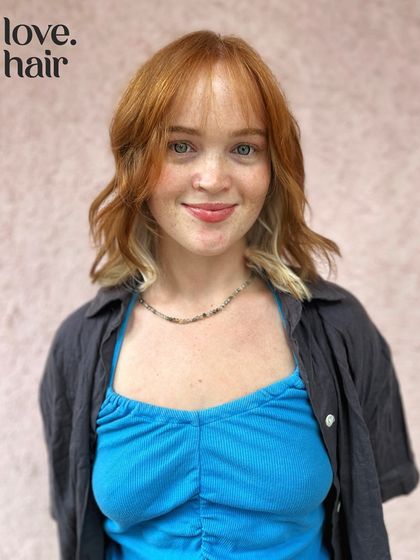 Cute girls and cute hair. This client is rocking her unique colour combo of natural red with a bold, platinum blonde peekaboo panel underneath.