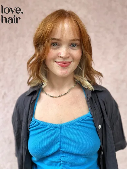 Cute girls and cute hair. This look features a trendy peekaboo color with a bright white-blonde underlayer beneath a coppery red top.