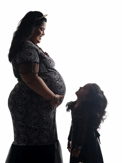 A silhouette is a timeless and artistic way to capture the bond between a mother and child. In the studio, we can play with light to create these dramatic, emotional portraits that focus purely on shape and connection.
