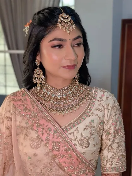 This photo captures the serene and glowing look we achieved for Rashi. The focus was on enhancing her natural features for a subtle yet stunning bridal appearance.
