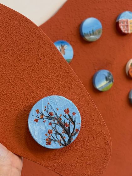 This miniature captures the beauty of cherry blossoms. Each small painting is a work of art on its own, contributing to the larger story.