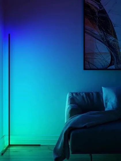 Smart, minimalist lighting solutions like this RGB corner floor lamp can be integrated into your room's automation. You can control color and brightness with your phone or a central remote to set the perfect vibe.