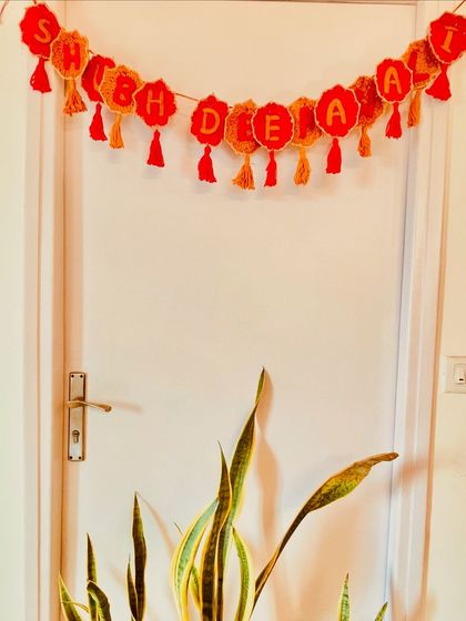 Another look at the festive Diwali bunting. The length is adjustable, so you can hang it on a large entrance door or a smaller temple. I can also make these for birthdays, anniversaries, or any other occasion.